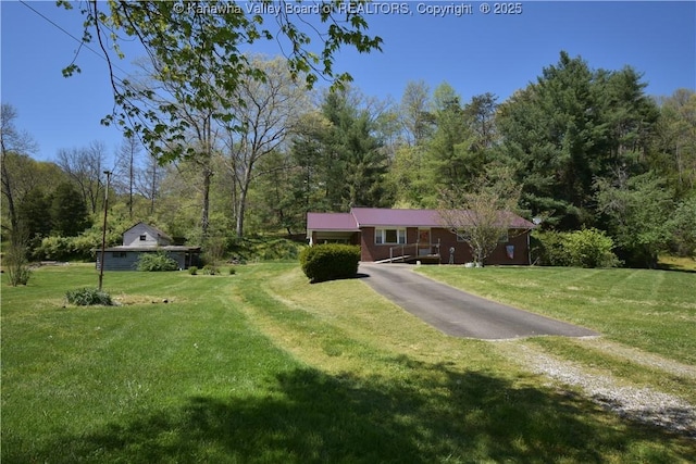 6 Coast Run Rd, Sandyville, WV 25275 - ranch-style home featuring asphalt driveway, a front lawn, and a view of trees