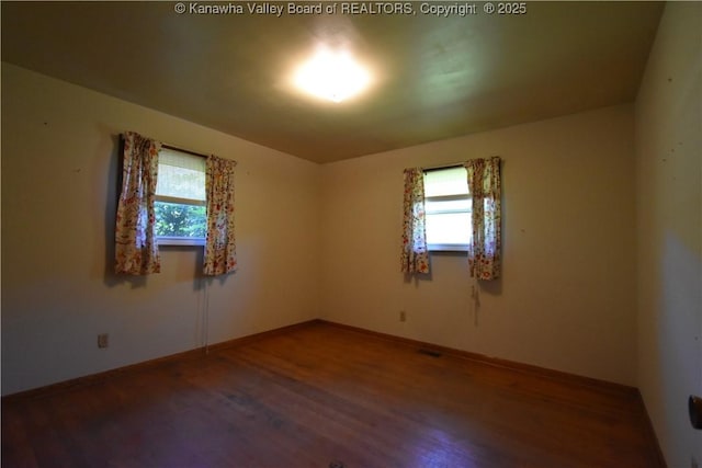 6 Coast Run Rd, Sandyville, WV 25275 - empty room with wood finished floors, healthy amount of natural light, and baseboards