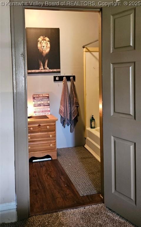 160 Davis St, Huntington, WV 25705 - bathroom featuring shower / washtub combination and wood finished floors