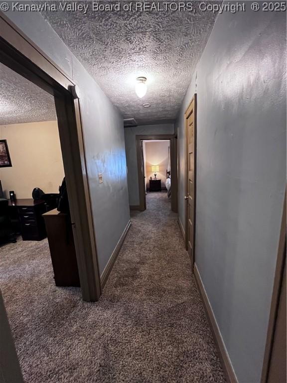 160 Davis St, Huntington, WV 25705 - hallway featuring carpet flooring, a textured ceiling, and an office area