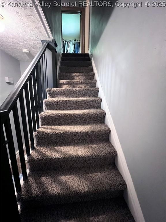 160 Davis St, Huntington, WV 25705 - stairs with carpet and baseboards