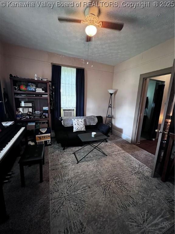 160 Davis St, Huntington, WV 25705 - living area with carpet floors, a textured ceiling, ceiling fan, and baseboards