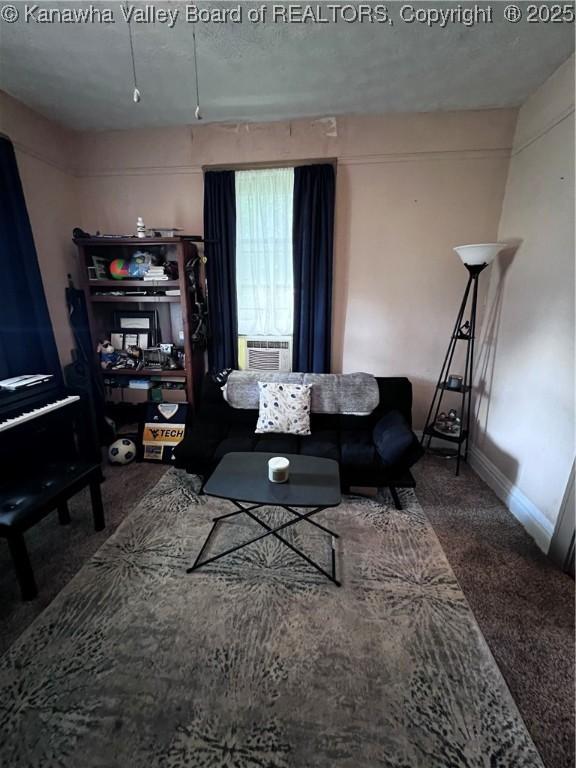 160 Davis St, Huntington, WV 25705 - carpeted living area featuring cooling unit and baseboards