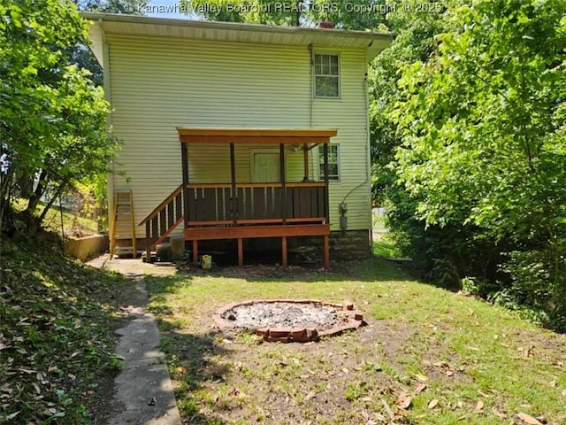 160 Davis St, Huntington, WV 25705 - back of property featuring a fire pit, stairs, a deck, and a lawn