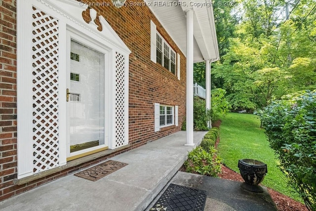 169 Burning Springs Dr, Belle, WV 25015 - doorway to property with brick siding and a yard