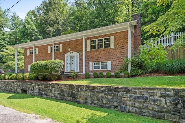169 Burning Springs Dr, Belle, WV 25015 - split foyer home featuring a chimney and brick siding