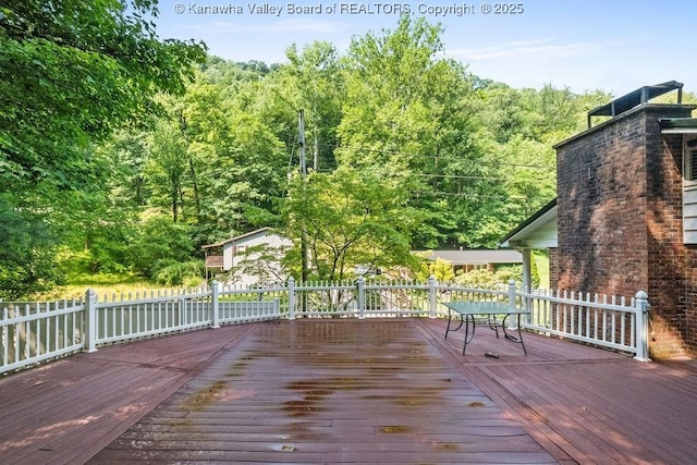 169 Burning Springs Dr, Belle, WV 25015 - wooden deck with a wooded view