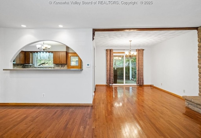 169 Burning Springs Dr, Belle, WV 25015 - unfurnished living room featuring a chandelier, wood finished floors, plenty of natural light, and recessed lighting