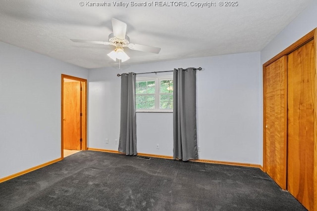 169 Burning Springs Dr, Belle, WV 25015 - unfurnished bedroom featuring baseboards, carpet floors, a closet, and a ceiling fan