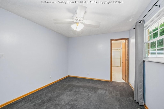169 Burning Springs Dr, Belle, WV 25015 - unfurnished room featuring baseboards, dark carpet, and ceiling fan