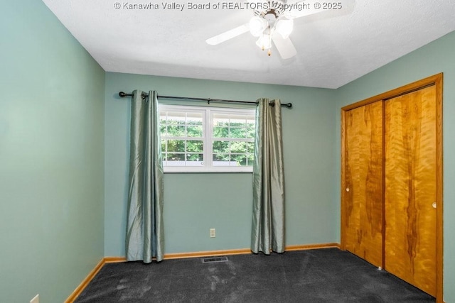 169 Burning Springs Dr, Belle, WV 25015 - unfurnished bedroom featuring carpet floors, baseboards, a ceiling fan, and a closet