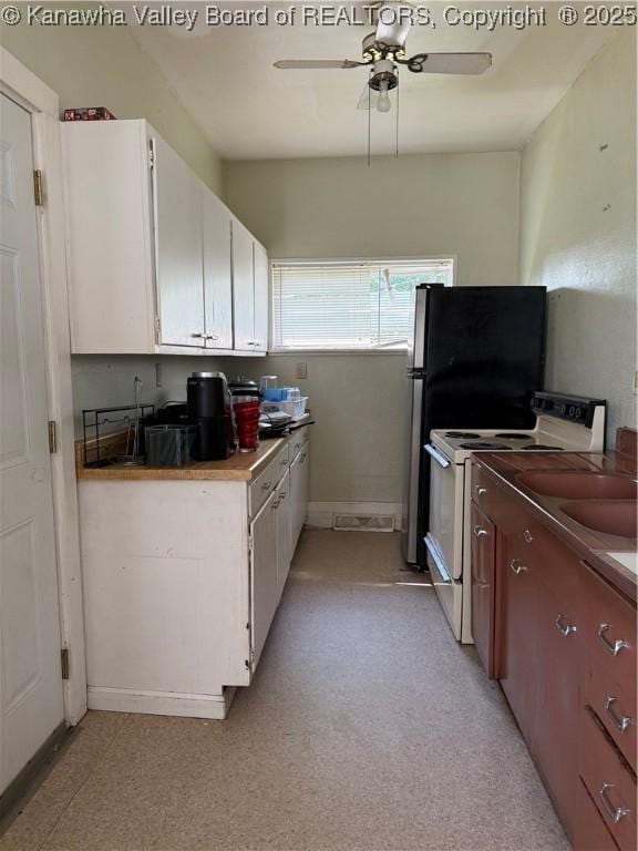 1123 Beech Ave, Charleston, WV 25312 - kitchen featuring white range with electric cooktop, a ceiling fan, white cabinetry, and a sink