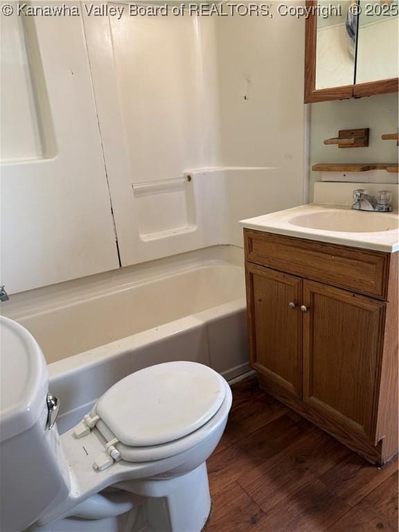 1123 Beech Ave, Charleston, WV 25312 - full bathroom featuring vanity, wood finished floors, toilet, and tub / shower combination