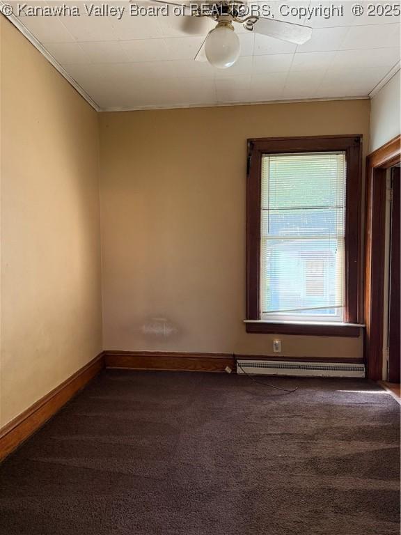 1123 Beech Ave, Charleston, WV 25312 - empty room with carpet, crown molding, ceiling fan, baseboards, and a baseboard radiator