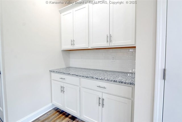 4210 Fairway Xing, South Charleston, WV 25309 - bar area with decorative backsplash, baseboards, and wood finished floors