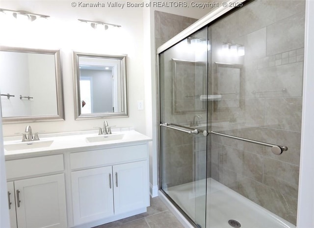 4210 Fairway Xing, South Charleston, WV 25309 - bathroom with double vanity, a stall shower, and tile patterned flooring