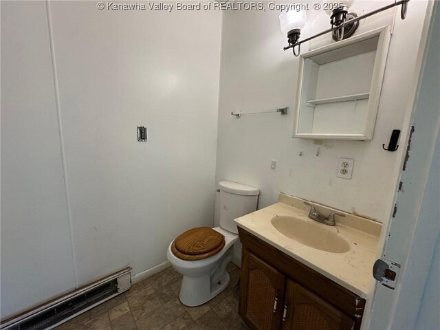 2608 Procious Maysel Rd, Wv, WV 25133 - half bath featuring toilet, baseboard heating, vanity, and stone finish floors