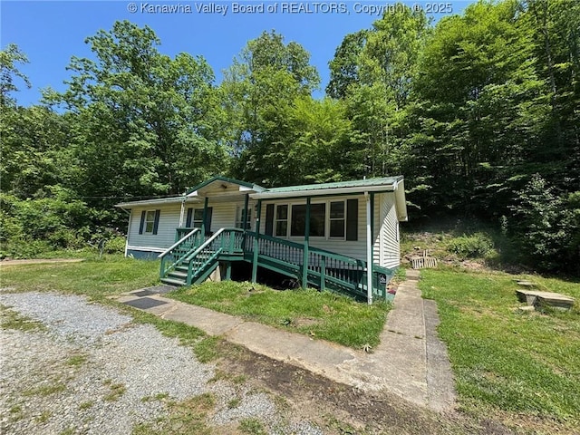 2608 Procious Maysel Rd, Wv, WV 25133 - bungalow featuring covered porch, a front lawn, stairs, and metal roof