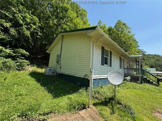 2608 Procious Maysel Rd, Wv, WV 25133 - view of side of home with a yard and cooling unit