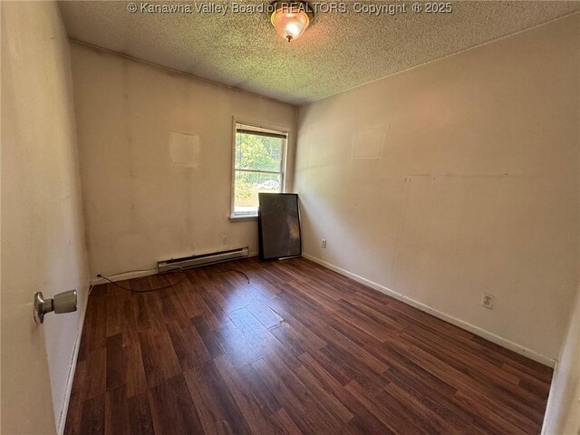 2608 Procious Maysel Rd, Wv, WV 25133 - spare room with a baseboard heating unit, wood finished floors, a textured ceiling, and baseboards