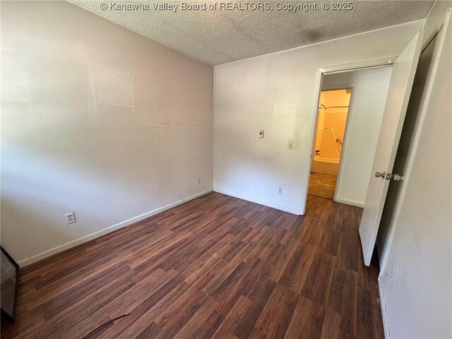 2608 Procious Maysel Rd, Wv, WV 25133 - empty room featuring wood finished floors, a textured ceiling, and baseboards
