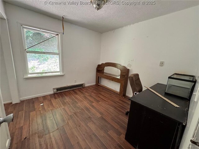 2608 Procious Maysel Rd, Wv, WV 25133 - office space featuring a baseboard heating unit, wood finished floors, a textured ceiling, and baseboards