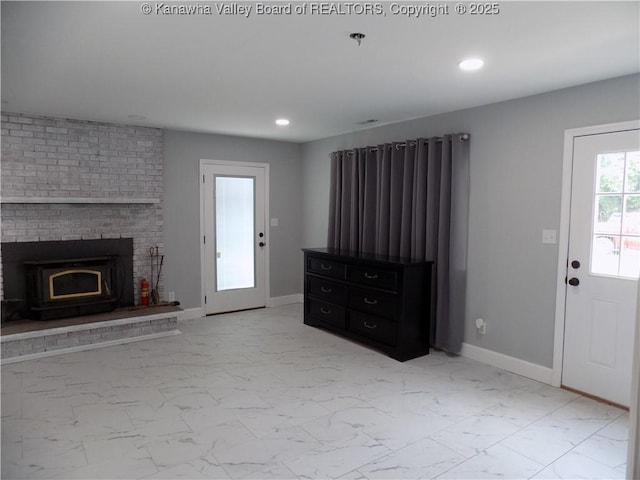 1004 E Riverview Dr, Belle, WV 25015 - unfurnished living room featuring light marble finish flooring, recessed lighting, and a fireplace