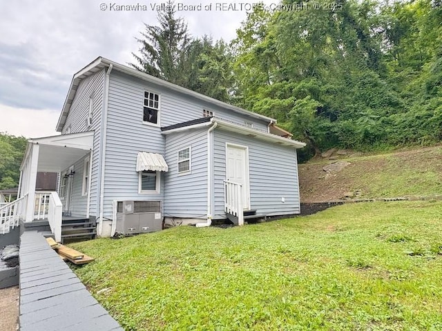 547 Garrison Ave, Charleston, WV 25302 - view of property exterior featuring a lawn and covered porch