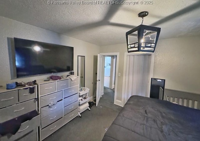 547 Garrison Ave, Charleston, WV 25302 - bedroom featuring a textured ceiling, a chandelier, a textured wall, and ceiling fan