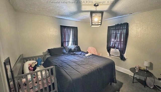 547 Garrison Ave, Charleston, WV 25302 - bedroom featuring a textured wall, a textured ceiling, and baseboards