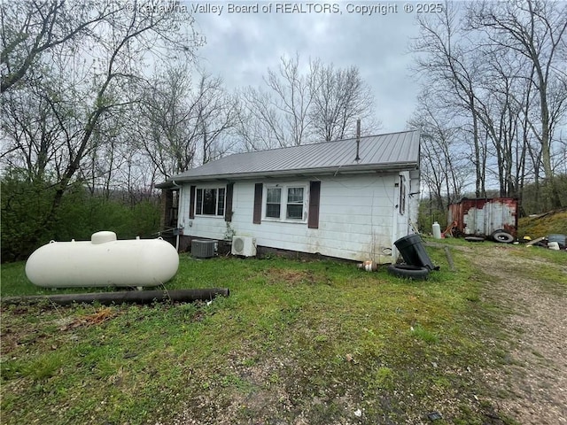 630 Melody Ln, Charleston, WV 25313 - view of front of property with metal roof, central AC unit, and a front yard