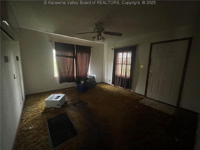 630 Melody Ln, Charleston, WV 25313 - unfurnished living room featuring ceiling fan and carpet flooring