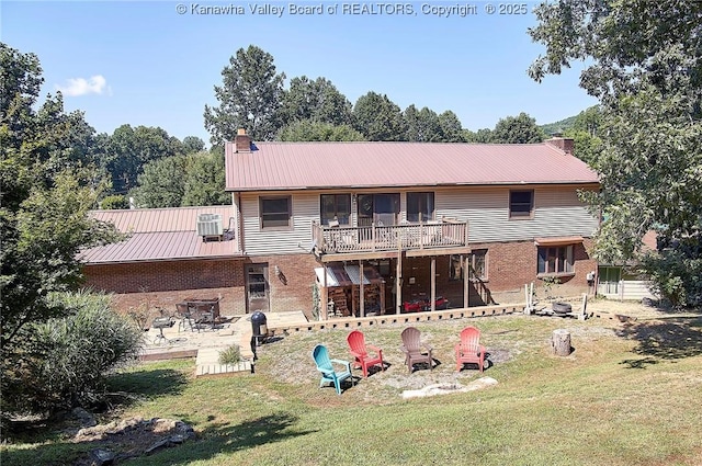 124 Morningside Dr, Elkview, WV 25071 - back of house with an outdoor fire pit, a chimney, a yard, and brick siding
