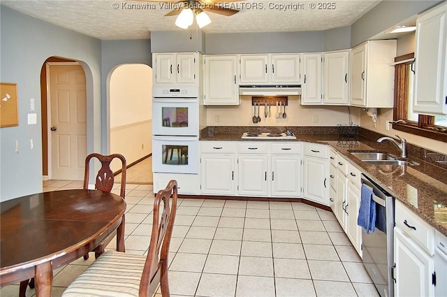 124 Morningside Dr, Elkview, WV 25071 - kitchen with white appliances, ceiling fan, arched walkways, dark stone countertops, and a textured ceiling