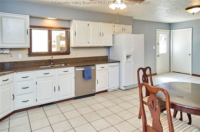 124 Morningside Dr, Elkview, WV 25071 - kitchen featuring stainless steel dishwasher, white fridge with ice dispenser, white cabinetry, a textured ceiling, and light tile patterned floors