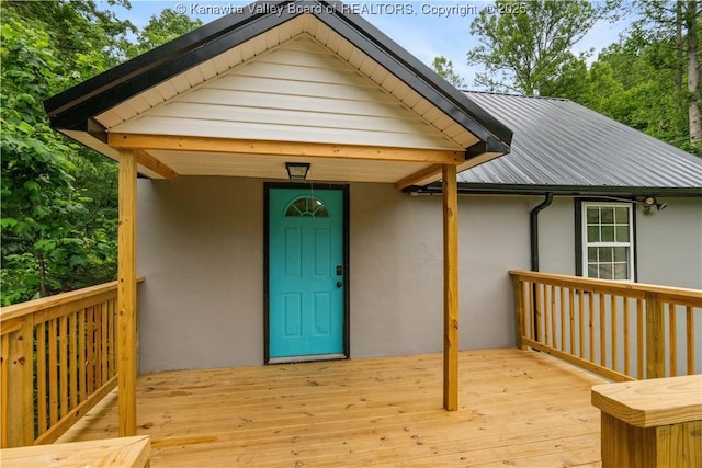 3742 Greenview Rd, South Charleston, WV 25309 - entrance to property with stucco siding, a metal roof, and a wooden deck