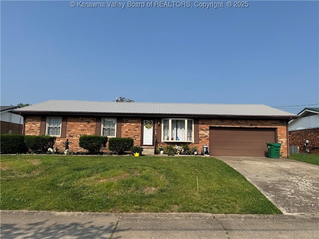 194 Shawnee Ests, Winfield, WV 25213 - ranch-style home with brick siding, a front yard, and an attached garage