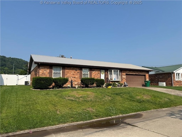 194 Shawnee Ests, Winfield, WV 25213 - single story home with brick siding, a gate, a garage, driveway, and a metal roof