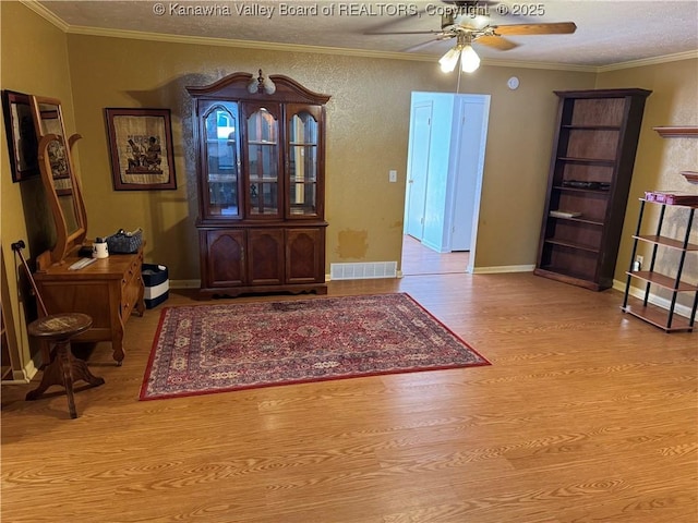 194 Shawnee Ests, Winfield, WV 25213 - foyer with wood finished floors, a ceiling fan, ornamental molding, and a textured ceiling