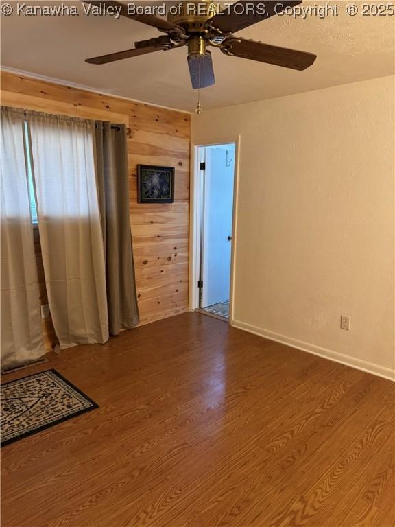194 Shawnee Ests, Winfield, WV 25213 - spare room with a ceiling fan and wood finished floors