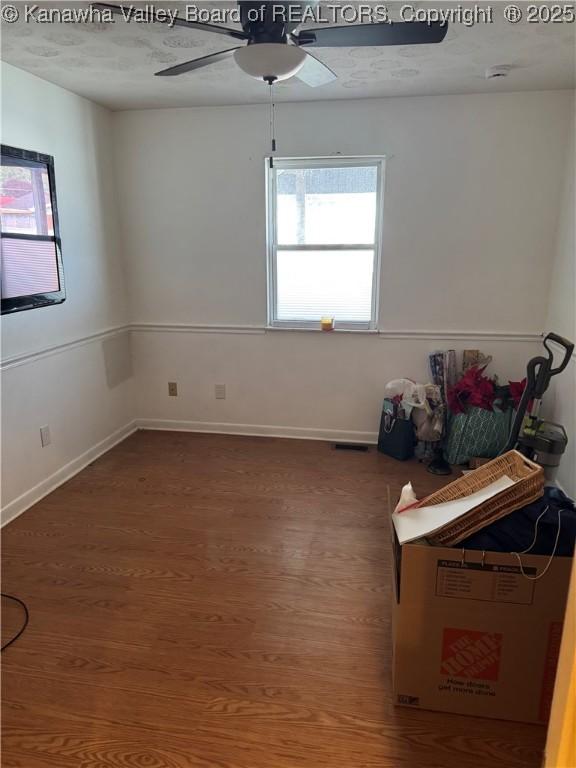 194 Shawnee Ests, Winfield, WV 25213 - empty room with wood finished floors and a ceiling fan