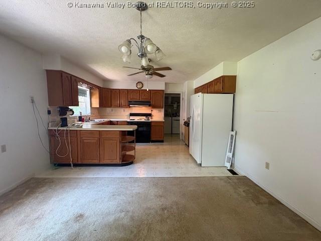 3202 Wallback Rd, Wallback, WV 25285 - kitchen featuring white appliances, under cabinet range hood, a ceiling fan, a peninsula, and light countertops