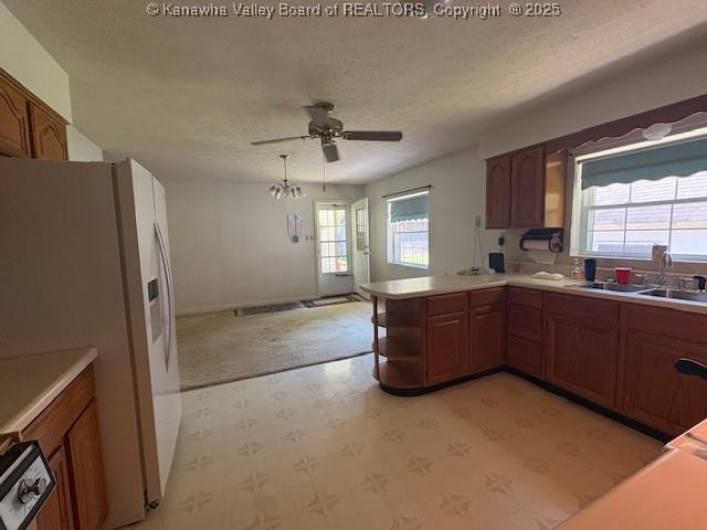 3202 Wallback Rd, Wallback, WV 25285 - kitchen featuring white fridge with ice dispenser, a ceiling fan, light flooring, a textured ceiling, and a peninsula