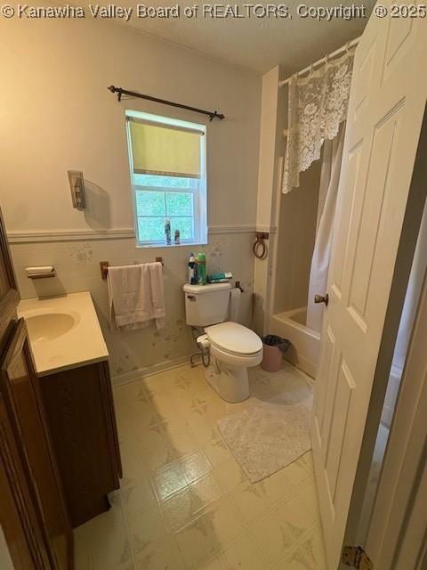 3202 Wallback Rd, Wallback, WV 25285 - full bath featuring vanity, a wainscoted wall, tile walls, tile patterned floors, and shower / bath combo