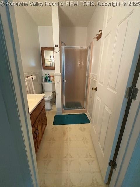 3202 Wallback Rd, Wallback, WV 25285 - full bathroom featuring vanity, a shower stall, tile patterned floors, wainscoting, and a textured ceiling