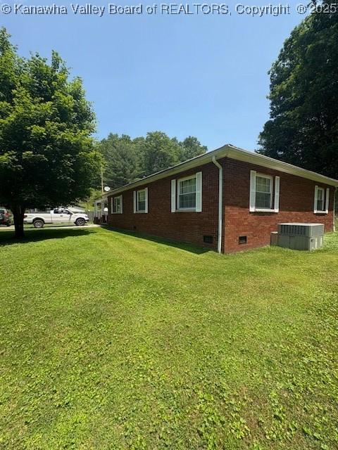 3202 Wallback Rd, Wallback, WV 25285 - view of side of property featuring crawl space, brick siding, and a yard
