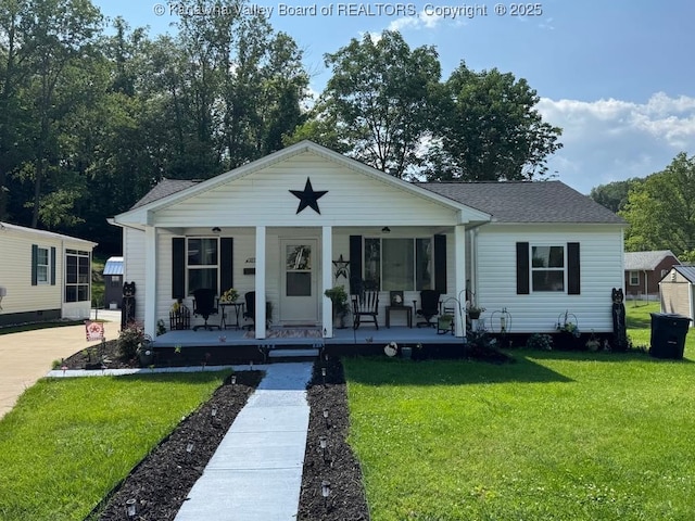 1003 Ridge Dr, South Charleston, WV 25309 - bungalow-style home featuring covered porch, a front yard, and a shingled roof