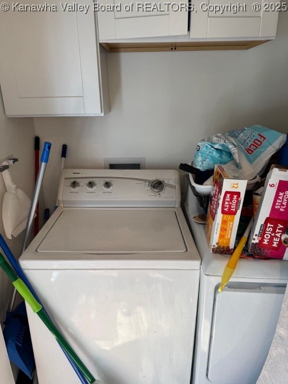 1003 Ridge Dr, South Charleston, WV 25309 - laundry room featuring washing machine and dryer and cabinet space