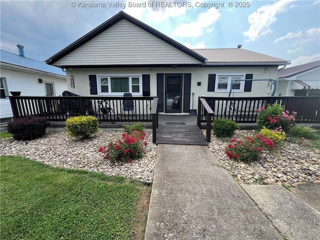 912 Ann St, Ravenswood, WV 26164 - view of front of home featuring a wooden deck and a metal roof