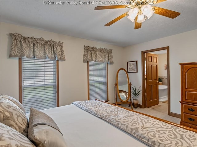 53 Wildrose Ln, Scott Depot, WV 25560 - bedroom with connected bathroom and a ceiling fan